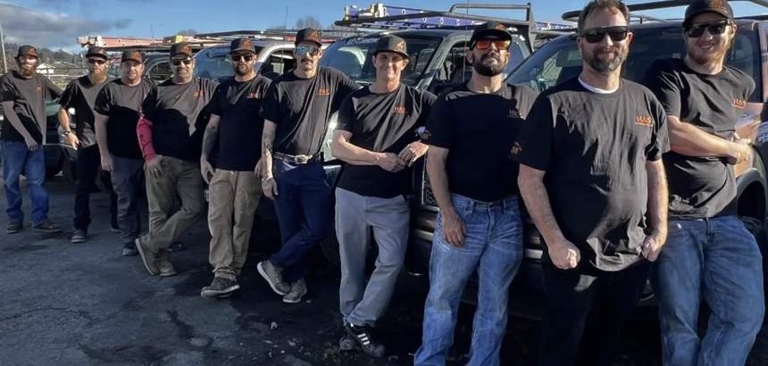Travis Hunter with his tree services crew